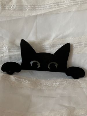 wood   sihlouette  peeking cat 